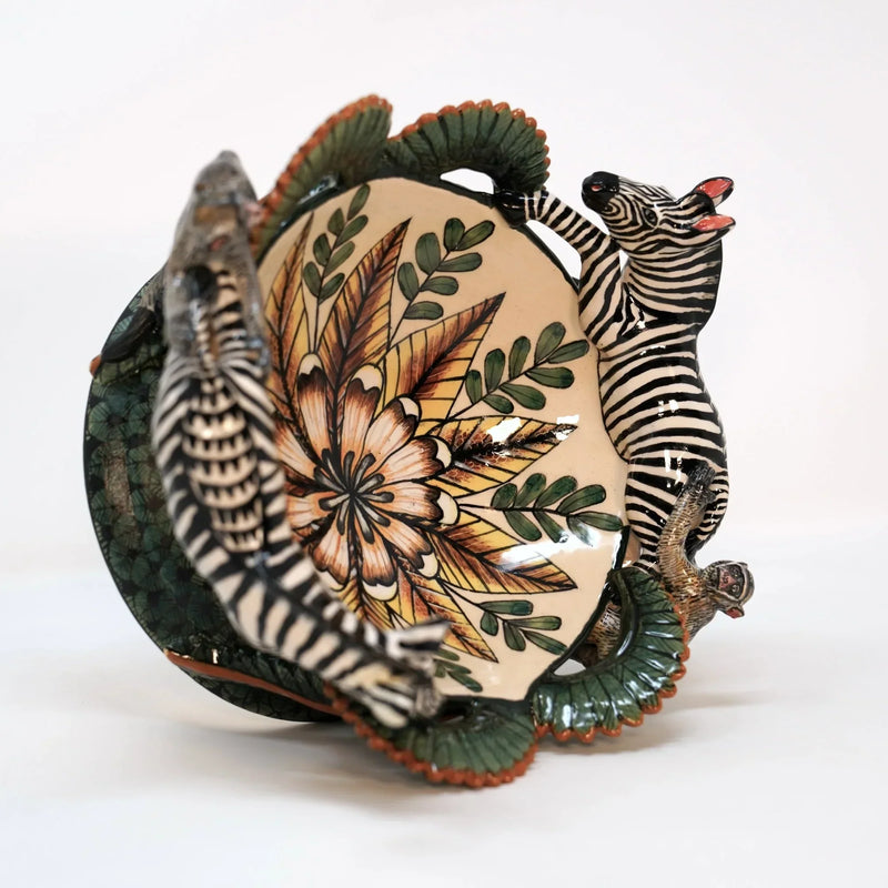 Ardmore ceramic bowl with sculpted zebra, monkey and hand-painted botanical details at Hartford House.
